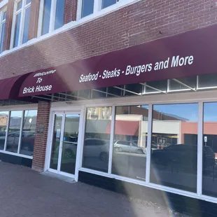 Outside of restaurant, on the corner of Main Street.