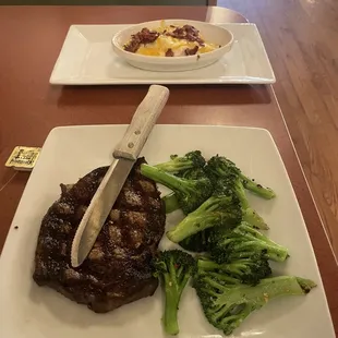 Ribeye steak , mashed potatoes and veggie of the day