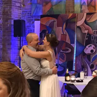 a bride and groom sharing a kiss