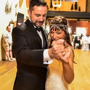 a bride and groom dancing