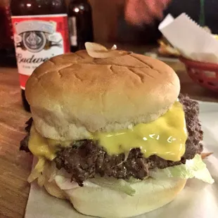 The burger with cheese, grilled onions and deluxe.