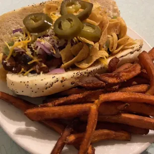a hot dog and fries on a plate