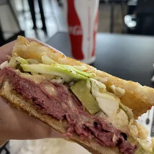 Corned beef on sourdough with dill pickle and Cole slaw.