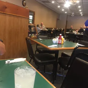 a man sitting at a table in a restaurant