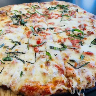 a pizza on a cutting board