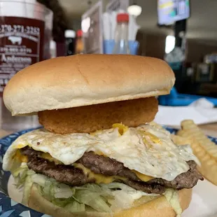 Double cheeseburger with egg and cheese sticks