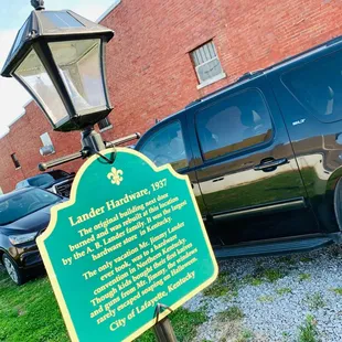 a sign in front of a building