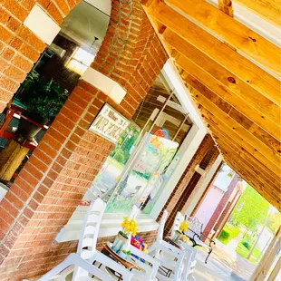 a row of white rocking chairs