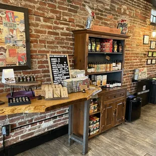 a coffee shop with a brick wall