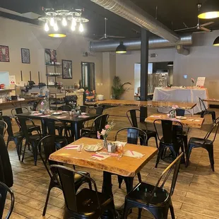 a dining room with tables and chairs