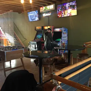 a man playing a game of pinball