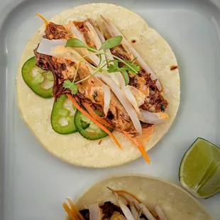 Taco Tuesday just got better!

 Short Rib Tacos
Jalapeño
Pickled Carrots
Pickled Daikon
Bean Sprouts
Cilantro
Kimchi Aioli