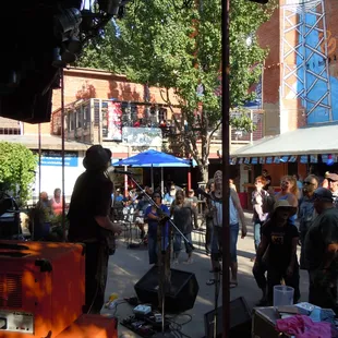 a crowd of people standing and sitting