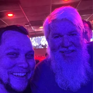 two men smiling for the camera