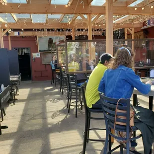 awesome covered patio with the neatest mini fire pits in the middle of the table