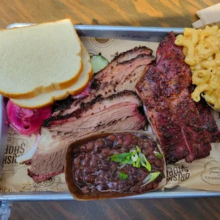 Brisket, ribs, beans, mac and cheese, potato bread, onions and cucumber