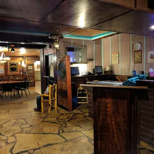 a bar with a stone floor