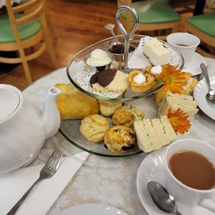 Tea and variety of tea sandwiches and pastries