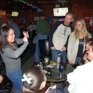 a group of people at a bar