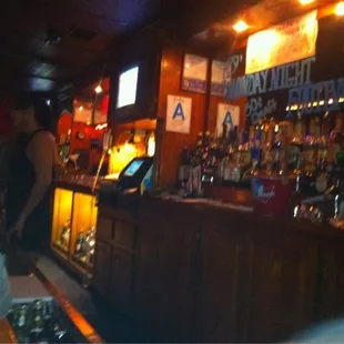 a woman standing at a bar