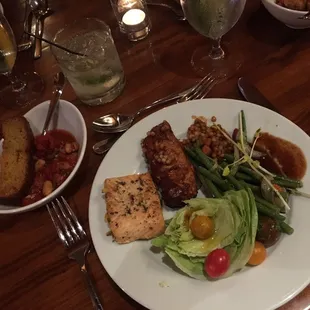 Buffet dinner for a private dinner.  Ribeye, salmon, BBQ bourbon chicken, wedge salad, green beans. Turkey chili and amazing cornbread