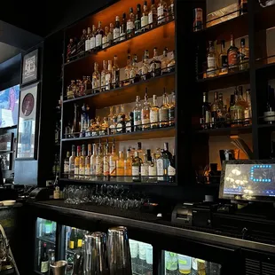 a bar filled with liquor bottles