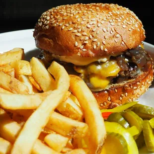 a hamburger and fries on a plate
