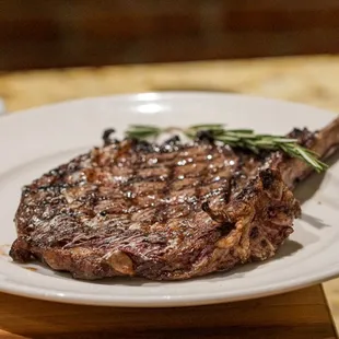 a steak on a white plate