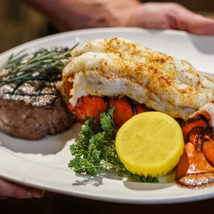 a person holding a plate of food