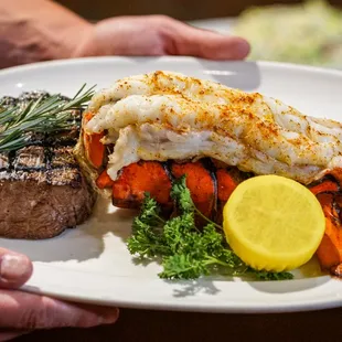 a person holding a plate of food