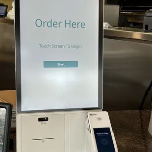 an order sign and a phone