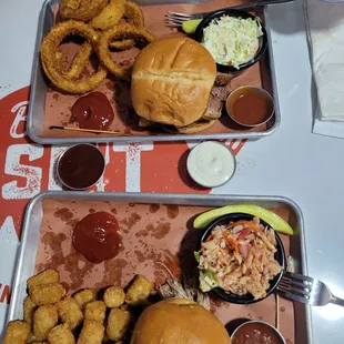 Brisket sandwich with creamy slaw and onion rings. Pork sandwich with red slaw and tater tots. Amazing!