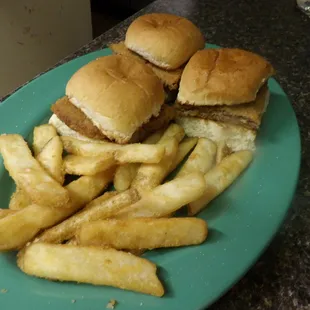 a plate of hamburgers and french fries