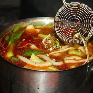 Once everything was cooked, we scooped out our hot pot contents into a bowl.