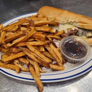 a plate of french fries and a burger