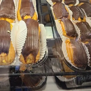 a variety of pastries in a display case