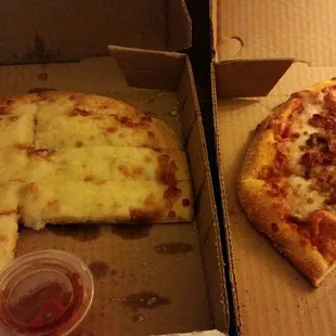 Delicious cheese bread and pizza with bacon and hamburger.