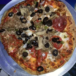 The deluxe with added olives. This place makes their own dough daily.