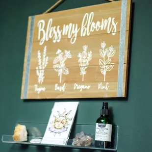 a wooden sign above a glass shelf