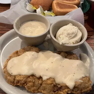 Chicken Fried steak with mashed potatoes and gravy.
