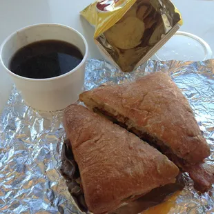 Garlic Roasted Steak Sandwich that came with Au jus and chips
