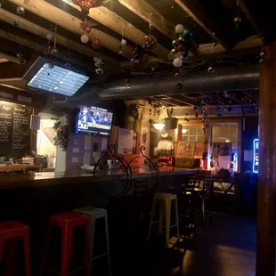 a bar with red stools