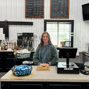 a woman behind the counter