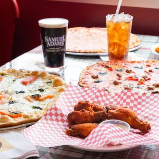 a variety of pizzas and drinks