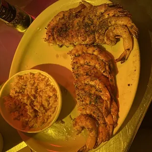 a plate of shrimp and rice