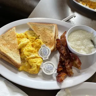 Two eggs anyway (plus cheese) with grits and a side of bacon