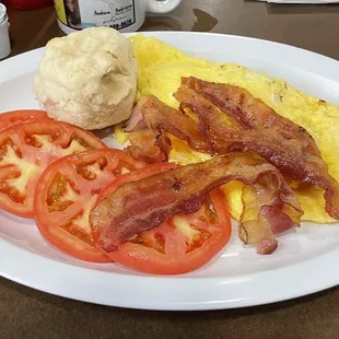Three egg omelette (cheese and ham), tomatoes and biscuit, with side of bacon