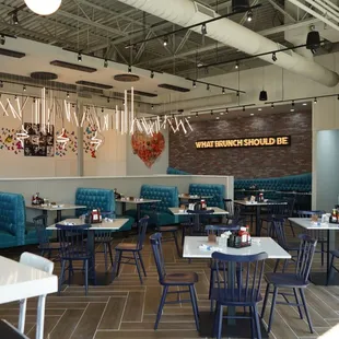 a dining area with tables and chairs