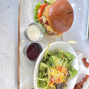 Whiskey BBQ burger and side salad with ranch and raspberry vinaigrette
