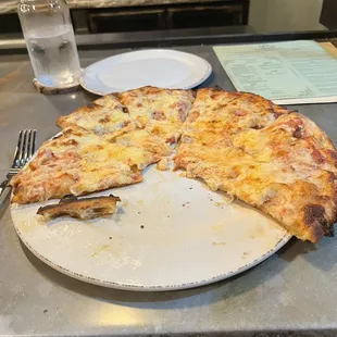 a half eaten pizza on a plate